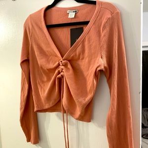 Peach colored ruched crop top